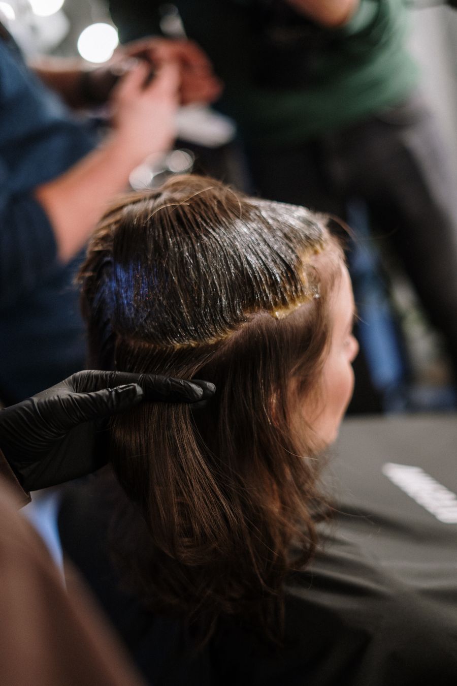 Client having hair colour applied