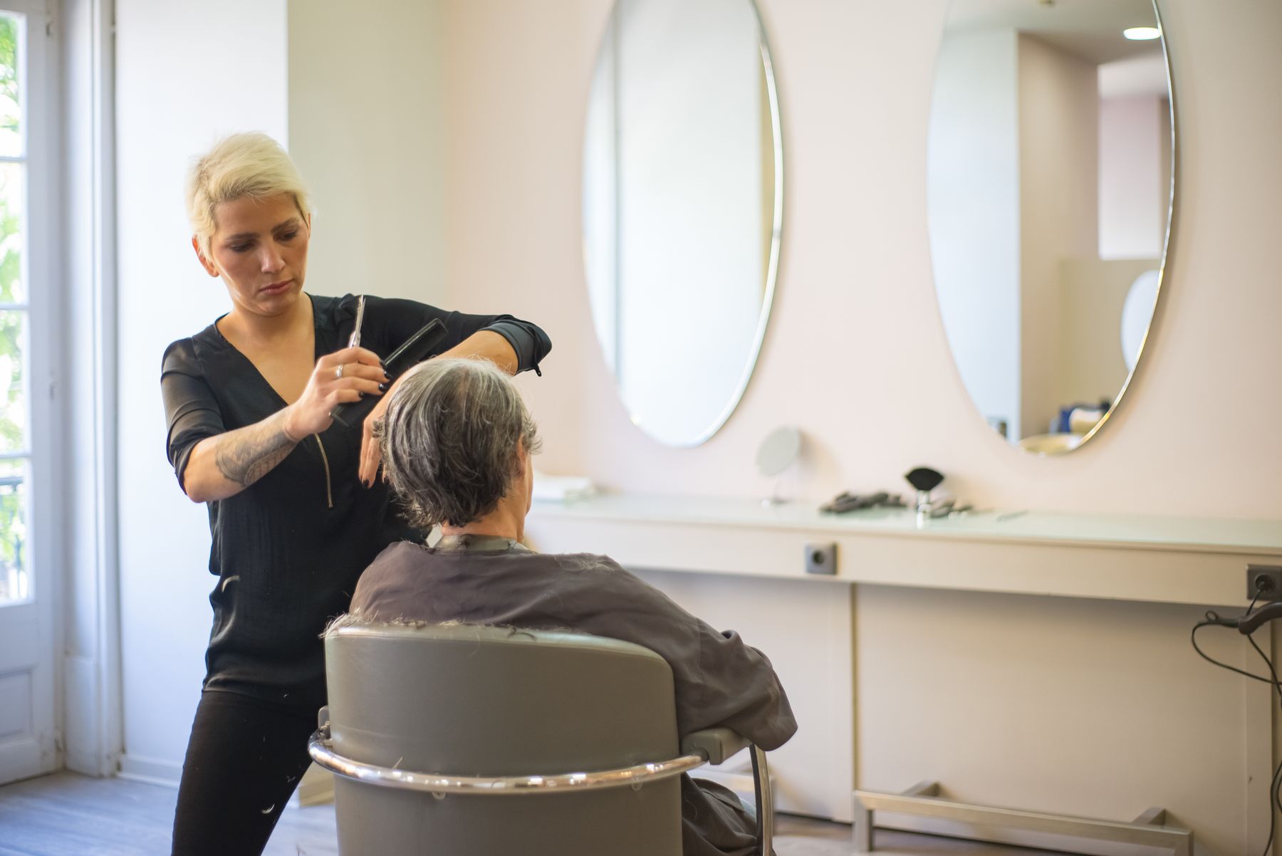 Stylist cutting a client's hair